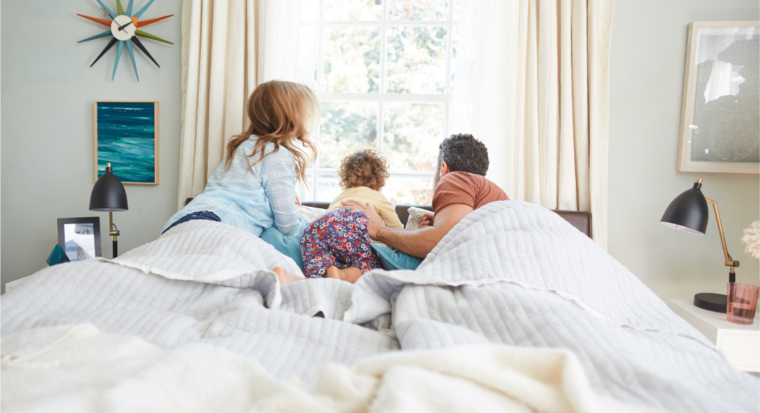 Family on a Sealy bed